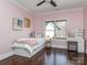 This charming bedroom features hardwood floors, a bed, and a vanity at 1404 Lookout Cir, Waxhaw, NC 28173