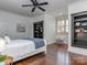 This bedroom features hardwood floors, natural light, and stylish bookcases at 1404 Lookout Cir, Waxhaw, NC 28173