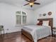 Bedroom with hardwood floors, lots of natural light and a teddy bear on the bed at 1404 Lookout Cir, Waxhaw, NC 28173