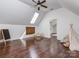 Bonus room featuring hardwood floors, a skylight, and a play area with a table and tent at 1404 Lookout Cir, Waxhaw, NC 28173