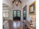 Elegant foyer with dark hardwood floors, high ceilings, and a striking chandelier at 1404 Lookout Cir, Waxhaw, NC 28173