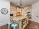 Gourmet kitchen with a large island, granite countertops, and stainless steel appliances at 1404 Lookout Cir, Waxhaw, NC 28173