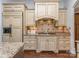 Beautiful kitchen with custom cabinets, granite countertops, and modern appliances at 1404 Lookout Cir, Waxhaw, NC 28173