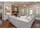 Cozy living room with a stone fireplace, built-in shelves, and comfortable seating at 1404 Lookout Cir, Waxhaw, NC 28173
