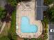 Aerial view of community pool surrounded by lush greenery and seating at 15042 Deshler Ct, Charlotte, NC 28273