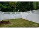 Private backyard enclosed by a white wood fence at 15042 Deshler Ct, Charlotte, NC 28273