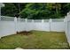 Fenced backyard features a small garden bed and gate at 15042 Deshler Ct, Charlotte, NC 28273