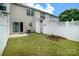 Backyard features well-kept lawn, fenced in yard with a small garden at 15042 Deshler Ct, Charlotte, NC 28273