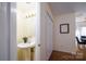 Neat half-bathroom with a pedestal sink, oval mirror, and well-maintained fixtures at 15042 Deshler Ct, Charlotte, NC 28273