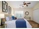 Comfortable bedroom with neutral walls, ceiling fan, carpet, and a large window at 15042 Deshler Ct, Charlotte, NC 28273