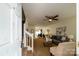 Cozy living room with neutral tones, a ceiling fan, and an open floor plan at 15042 Deshler Ct, Charlotte, NC 28273