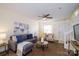 Inviting living room featuring a plush sofa, ceiling fan, and plenty of natural light at 15042 Deshler Ct, Charlotte, NC 28273