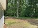 View of backyard with lawn, trees, and side of house at 1521 Park Ave, Salisbury, NC 28146