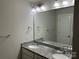 Bathroom featuring a dual sink vanity with granite countertop and brushed nickel hardware at 1521 Park Ave, Salisbury, NC 28146