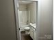 Clean bathroom with a shower-tub combo, modern vanity, and a neutral color palette at 1521 Park Ave, Salisbury, NC 28146