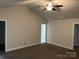 View of bedroom with neutral tones, plush carpet, and a ceiling fan at 1521 Park Ave, Salisbury, NC 28146