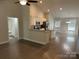 Bright open floor plan with a modern kitchen featuring stainless steel appliances, granite countertops, and hardwood floors at 1521 Park Ave, Salisbury, NC 28146