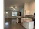 This open kitchen features stainless appliances, white cabinets, granite countertops and an island at 1521 Park Ave, Salisbury, NC 28146