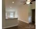 Open-concept living area with lots of natural light, hardwood floors, neutral paint, and views into the kitchen area at 1521 Park Ave, Salisbury, NC 28146