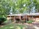 Spacious backyard showing the deck with a covered patio perfect for entertaining and enjoyment at 160 Eagle Dr, Salisbury, NC 28144