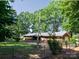 Fenced-in backyard shows a peaceful outdoor living area surrounded by mature trees offering privacy at 160 Eagle Dr, Salisbury, NC 28144