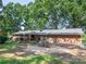 The backyard features a comfortable seating area and a charming garden, creating a serene outdoor space at 160 Eagle Dr, Salisbury, NC 28144