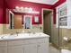 Bathroom with double sink vanity, decorative backsplash, tiled shower, and plenty of natural light at 160 Eagle Dr, Salisbury, NC 28144