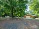 A nicely landscaped property with mature trees and a well-maintained lawn offers great curb appeal at 160 Eagle Dr, Salisbury, NC 28144