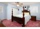 Spacious main bedroom with a decorative four-post bed, ceiling fan, and ample natural light at 160 Eagle Dr, Salisbury, NC 28144