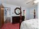 Spacious main bedroom with a decorative four-post bed, ceiling fan, and large mirror at 160 Eagle Dr, Salisbury, NC 28144