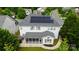 Aerial view of home featuring solar panels and screened-in porch at 16012 Caranna Ct, Charlotte, NC 28277