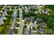 An aerial view of a neighborhood with well-maintained homes and landscaping at 16012 Caranna Ct, Charlotte, NC 28277