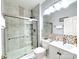 Updated bathroom featuring a glass-enclosed shower and a modern vanity at 16012 Caranna Ct, Charlotte, NC 28277