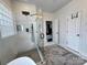 Bright bathroom featuring a glass-enclosed shower with a shower head and body spray at 16012 Caranna Ct, Charlotte, NC 28277