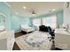 Large bedroom features stylish decor, a ceiling fan, and ample natural light from multiple windows at 16012 Caranna Ct, Charlotte, NC 28277