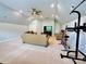 Spacious bonus room with neutral walls and carpet, ceiling fan and pull-up bar at 16012 Caranna Ct, Charlotte, NC 28277