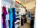 Walk-in closet with built-in shelving and hanging rods for organized storage at 16012 Caranna Ct, Charlotte, NC 28277