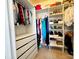 Walk-in closet featuring built-in shelving and drawers for maximum storage and organization at 16012 Caranna Ct, Charlotte, NC 28277