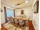 Formal dining room with a large table, elegant chairs, and a stylish chandelier at 16012 Caranna Ct, Charlotte, NC 28277