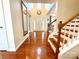 Spacious foyer with hardwood floors, a grand staircase, and an abundance of natural light at 16012 Caranna Ct, Charlotte, NC 28277