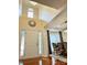 Foyer featuring a soaring ceiling, decorative mirrors, and an elegant front door with sidelights at 16012 Caranna Ct, Charlotte, NC 28277