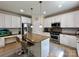 Well-equipped kitchen with granite countertops, stainless steel appliances, and a functional island with seating at 16012 Caranna Ct, Charlotte, NC 28277