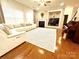 Spacious living room with a fireplace, hardwood floors, neutral tones, and an open layout at 16012 Caranna Ct, Charlotte, NC 28277