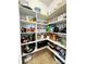 Organized walk-in pantry with ample shelving, providing plenty of storage for all your kitchen essentials at 16012 Caranna Ct, Charlotte, NC 28277