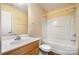 Bathroom includes a single sink vanity, toilet, and shower-tub combo with white tile surround at 170 Glenn Allen Rd, Mooresville, NC 28115