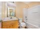 Bright bathroom featuring vanity, toilet, and shower-tub combo with natural light at 170 Glenn Allen Rd, Mooresville, NC 28115