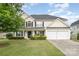 Charming two-story home featuring a well-manicured lawn, a two-car garage, and a classic facade at 170 Glenn Allen Rd, Mooresville, NC 28115