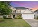 Charming two-story home featuring a well-manicured lawn, a two-car garage, and a classic facade at 170 Glenn Allen Rd, Mooresville, NC 28115