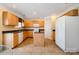 Spacious kitchen with wooden cabinetry, island, and white appliances at 170 Glenn Allen Rd, Mooresville, NC 28115