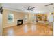 Open-concept living room with fireplace and view of the kitchen at 170 Glenn Allen Rd, Mooresville, NC 28115